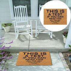 two white chairs sitting on top of a porch next to purple flowers and an orange door mat