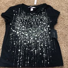 Black With Gold Sparkles Victoria Secret Fashion Show Tshirt Victoria's Secret Crew Neck T-shirt, Graphic Tee With Letter Print For Night Out, Victoria's Secret Casual Short Sleeve Top, Casual Short Sleeve Tops By Victoria's Secret, Trendy Victoria's Secret Crew Neck Top, Victoria's Secret Crew Neck T-shirt For Summer, Victoria's Secret Short Sleeve Summer Tops, Victoria's Secret Summer Tops With Short Sleeves, Victoria's Secret Short Sleeve Tops For Spring