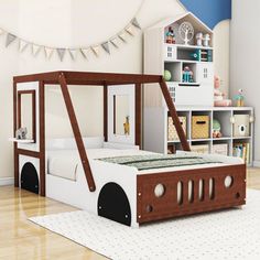 a child's bedroom with a wooden bed frame