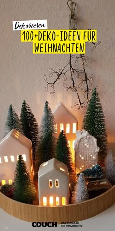 a wooden container filled with christmas trees and lit houses