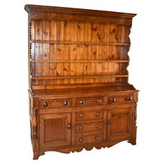 an old wooden dresser with drawers and cupboards on it's sides, isolated against a white background