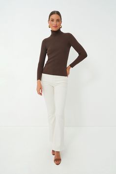 The Arlo Turtleneck Sweater is a classic layering piece that you’ll be wearing all season long, year after year. In a super comfy, stretch ribbed fabric, this fitted silhouette can be worn under a cardigan or tucked into your favorite denim. Style this versatile number under a blazer for a chic office outfit to give you a confidence boost before your next meeting or with mini skirts for effortless seasonal transitions. Fold back turtleneck Long sleeves Fitted Ribbed fabric Material: 43% Rayon, 2 Trendy Fitted Turtleneck Outerwear, Fitted Solid Turtleneck Outerwear, Elastane Tops For Workwear In Fall, Stretch Turtleneck Outerwear For Layering, Stretch Ribbed Turtleneck For Layering, Classic Stretch Sweater With Ribbed Neckline, Fitted Fine Knit Solid Outerwear, Fitted Fine Knit Outerwear, Classic Stretch Outerwear For Layering