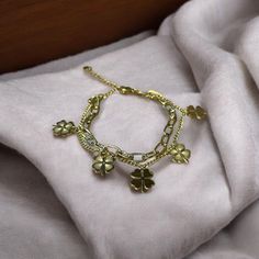 The bud leaf bracelet is a beautifully crafted accessory that captures the elegance of nature. Featuring delicate bud and leaf motifs, it symbolizes freshness and renewal. Handcrafted with attention to detail, this bracelet complements any style and adds a touch of sophistication to your look. Ideal for everyday wear, it seamlessly transitions from casual to formal settings. This versatile piece also makes a thoughtful gift for loved ones, representing a connection to nature and the beauty of gr Clover Bracelet, Good Wishes, Leaf Bracelet, Deep Meaning, Elegant Accessories, Four Leaf Clover, Clover Leaf, Stylish Accessories, Charm Bracelets