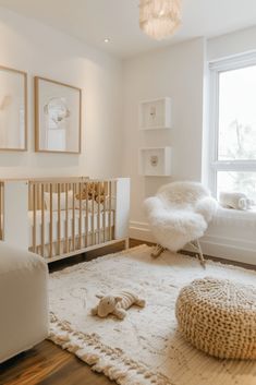 a baby's room with a white crib, rocking chair and large window