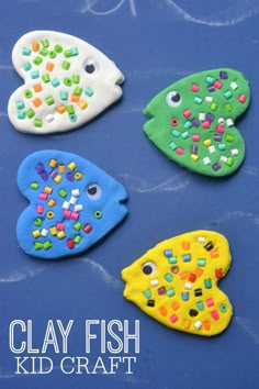 four clay fish made to look like they are decorated with beads and sprinkles