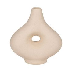 a white ceramic vase with a hole in the middle on a white background for decoration