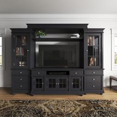 a living room with a large entertainment center