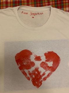 a t - shirt with a heart drawn on it