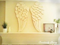 a fireplace mantel with an angel wing cutout on it