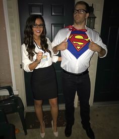 a man and woman are dressed up as superman and the girl is wearing a white shirt