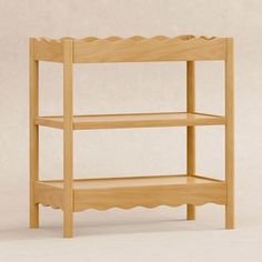 a wooden shelf with scalloped shelves on the top and bottom, against a plain background