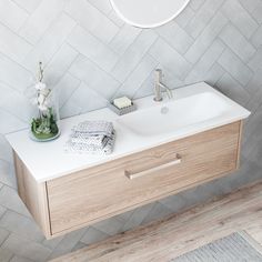 a bathroom vanity with a sink and mirror