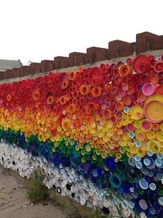 there is a wall made out of plastic bottles