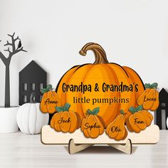 there is a sign that says grandpa and grandma's little pumpkins