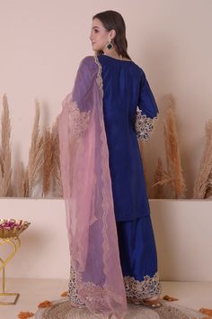 Blue kurta with floral, crescent moon embroidery using gota, zari and beaded work. Paired with a sharara with zari, floral embroidery on the hemline and baby pink dupatta with scallop trimmings. - Aza Fashions Blue Raw Silk Sharara With Dabka, Blue Dabka Raw Silk Sharara, Blue Silk Sharara With Dabka Embroidery, Blue Silk Sharara With Dabka Details, Blue Silk Sharara With Dabka, Blue Silk Lehenga With Dabka Work, Semi-stitched Blue Sharara With Dabka Detail, Semi-stitched Blue Sharara With Dabka, Traditional Blue Sharara With Dabka