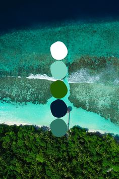 an aerial view of the ocean and beach with three circles on it's side