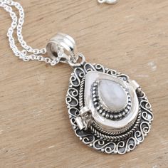 Crafted in India by Rakesh Rana, this sterling silver pendant necklace is a tender piece of art featuring a natural moonstone with unique properties. After adding a combination finish to the accessory, the gemstone crowns the design with a luminous accent, attracting peace and health. On top of that, it is also a locket that allows you to carry a little photo or item within. Moonstone Necklace With Large Pendant, Oxidized Moonstone Pendant Necklace, Bohemian Moonstone Teardrop Pendant Necklace, Moonstone Pendant Necklace With Oxidized Finish, Spiritual Engraved Moonstone Necklaces, Engraved Moonstone Pendant Necklace, Artisan White Moonstone Necklace, Engraved Moonstone Necklace For Spiritual Style, Elegant Oxidized Moonstone Jewelry