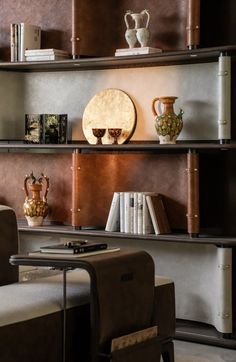 a living room filled with furniture and bookshelves