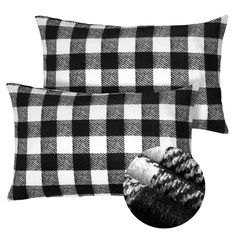 two black and white plaid pillows, one with a fur ball on the pillow cover