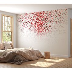 a room with a bed, window and large painting on the wall in red colors