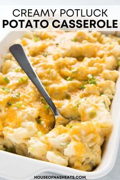 creamy potluck potato casserole in a white dish with a spoon