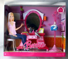 the barbie doll is sitting in her dressing room