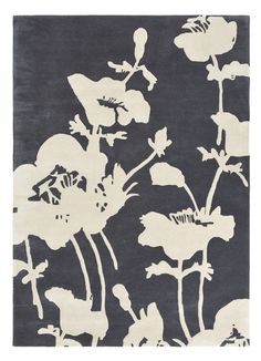 a black and white rug with flowers on it