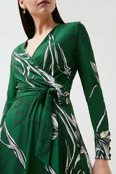 Stencilled With A Pencil-Drawn Floral Print, This Ethereal Midi Dress Is A Wearable Work Of Art. Its Slinky Jersey Fabric And Waist-Defining Tie Ensure It Flatters Any Figure - Add Strappy Stilettos To Dress It Up For Date Night. Green Printed Evening Dress, Elegant Abstract Print Maxi Dress For Spring, Elegant Spring Maxi Dress With Abstract Print, Elegant Maxi Dress With Abstract Print For Spring, Elegant V-neck Maxi Dress With Abstract Print, Fitted Maxi Dress With Floral Print And Surplice Neckline, Elegant Patterned Floral Print Maxi Dress, Elegant Floral Print Patterned Maxi Dress, Elegant Printed Green Midi Dress