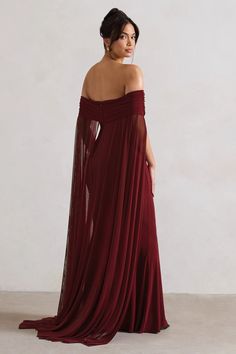 Exude an ethereal state of mind inCarlotta, our captivating cape maxi dress. Defined by a flowing chiffon cape, this berry maxi also boasts a timeless bardot neckline and floor length skirt. For the perfect wedding guest ensemble, style yours with a tousled bun and statement earrings.   Features  - Premium stretch jersey - Bardot neckline - Invisible zip closure  - Chiffon cape - Maxi length    Sizing & Fit  Model is 5'8 and wears UK size 8 / US size 4   Product Information     Double layered with good stretch  Premium jersey in Berry (95% Polyester, 5% Elastane)  155cm total length  SKU:CL131000037 Chiffon Cape, Bardot Neckline, Floor Length Skirt, Bridesmaid Outfit, Black Sequin Dress, Black Velvet Dress