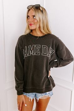 - Cheer on your team with this trendy 'GAME DAY' sweatshirt! Perfect for casual spirited moments, this cozy piece is an ideal option for putting a little pep in your step. - Unlined sweatshirt material - 'GAME DAY' lettering across the front - A crew cut neckline - Long, loose sleeves with ribbed cuffs - A relaxed silhouette that ends in a ribbed hemline - This piece is perfect for fans of Georgia, Texas Tech, Oklahoma State, Vanderbilt, Missouri, and more! Measurements S : Bust 44", Hip 44", Le Game Day Fall Crew Neck Sweatshirt, Game Day Crew Sweatshirt For Fall, Fall Game Day Crew Sweatshirt, Gray Letter Print Sweatshirt For Game Day, Gray Sweatshirt For Game Day In Winter, Game Day Gray Letter Print Sweatshirt, Gray Winter Sweatshirt For Game Day, Cotton College Style Sweatshirt For Game Day, Gray Graphic Print Sweatshirt For Game Day