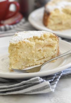 a piece of cake sitting on top of a white plate with a fork in it