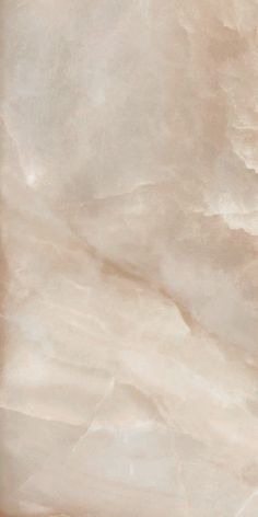 an image of a marble textured background in beige and pink tones with gold accents