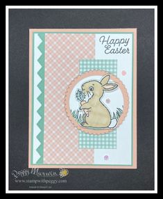 a happy easter card with a bunny holding flowers