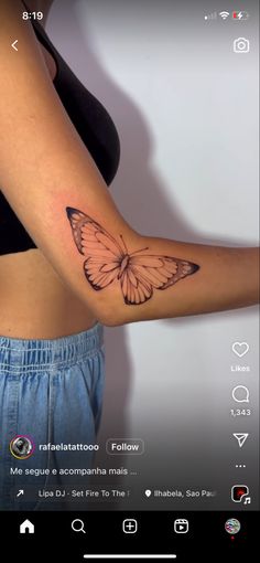 a woman's arm with a butterfly tattoo on the left side of her arm