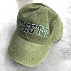 Store bought or homemade pesto? One size fits most dad hat. Embroidered in the USA. Hat made in Bangladesh. 100% cotton. Unisex. Cheap Trendy Dad Hat With Flat Brim, Cheap Funny Cap Style Hat, Cheap Vintage Dad Hat For Spring, Cheap Retro Dad Hat Baseball Cap, Affordable Vintage Dad Hat For Outdoor, Affordable Retro Dad Hat For Streetwear, Beautiful Hats Baseball, Cheap Green Cotton Dad Hat, Cheap Dad Hat For Spring Streetwear