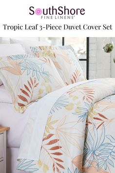 an image of a bed with tropical leaves on it and the words south shore fine linens tropic leaf 3 piece duvet cover set