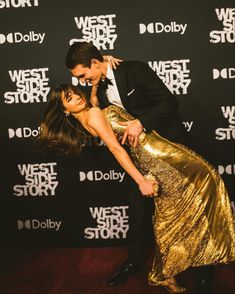 a man and woman dancing together on the red carpet at west side story world premiere