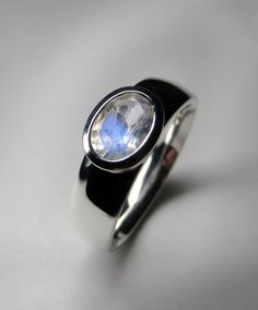 Silver ring with natural fine quality Moonstone  gemstone origin - Sri Lanka moonstone measurements - 0.079 х 0.2 x 0.28 in / 2 х 5 х 7 mm moonstone weight - 0.70 carat ring weight - 5.10 grams ring size - 5.5, 5.75, 6, 6.25, 7.25, 7.5 US ref No 11746 Worldwide shipping from Berlin, Germany. Minimal collection. Modern Moonstone Gemstone Rings, Modern Round Moonstone Rings, Modern Moonstone Ring With Oval Bezel Setting, Modern Oval Moonstone Ring With Bezel Setting, Oval Modern Moonstone Ring With Bezel Setting, Oval Moonstone Promise Ring With Polished Finish, Modern Polished Moonstone Ring For Anniversary, Polished Moonstone Ring With Round Stone For Anniversary, Modern Moonstone Ring With Polished Finish For Anniversary