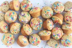 there are many muffins with sprinkles on them