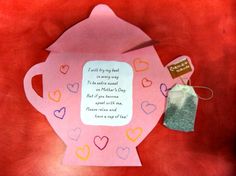 a teapot shaped card with a tag attached to it and some hearts on the side