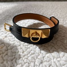 Hermes Rivale Double Tour Bracelet. Black Leather With Gold Hardware. New! Stickers All Intact. Never Worn. Size T2. Approx 13” L Not Including Buckle. Or Approx 13.5” L Including Buckle. Comes With Box And Pouch. 100% Auth. Poshmark Will Authenticate Items $500 And Up. I Will Not Go Any Lower Than $500 Since I Want This To Go Through The Authentication Process With Poshmark. Safer That Way. Thank You For Your Understanding. Hermes Bracelet, Hermes Jewelry, Bracelet Black, Womens Jewelry Bracelets, Bracelets For Men, That Way, Gold Hardware, Leather Bracelet, Black Leather