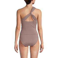 The perfect beach look starts with this stylish one shoulder tankini. Flattering and comfortable thanks to the shirring detail on the bodice, it’ll pair perfectly with your favorite bikini bottoms. And thanks to the eye-catching shine fabric, it is sure to be your favorite swim staple of the season. One Shoulder Tankini For The Beach, Chic Off-shoulder Swimwear For Beach Season, Chic Off-shoulder Swimwear For Beach, Seamless 4-way Stretch Sleeveless Swimwear, Stretch Halter Neck Swim Dress With Built-in Bra, Sleeveless Swimwear With Built-in Bra And 4-way Stretch, Sleeveless Nylon Swimwear With 4-way Stretch, Nylon Tankini With Built-in Bra And Triangle Top, High Neck Tankini Top