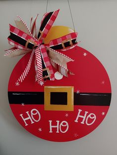 a christmas ornament hanging from the side of a wall