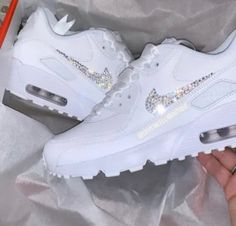 Your Custom Unique White Sparkly Crystal Nike Air Max 90 shoes are fully custom hand crystallised and guaranteed to bring some sparkly BLING to your life! These Nike Air Max 90 Trainers are 100% unique with no two pairs the same. Super comfortable shoes! 𝕀𝕄ℙℝ𝔼𝕊𝕊 𝔼𝕍𝔼ℝ𝕐𝕆ℕ𝔼 with these custom Crystalized Air Max Kicks today! Size: Please contact us if unsure on what size you need.  UK 2 / EU 34 / Girls 2.5Y UK 2.5 / EU 35 / Girls 3Y UK 3 / EU 35.5 / Girls 3.5Y UK 3.5 / EU 36 / Girls 4Y / Womens Air Max 90, Sick Shoes, 90 Shoes, Swarovski Nike, Nike Air Max 90s, Bedazzled Shoes, Nike Shoes Women Fashion, Bling Converse, Air Max 90s