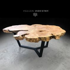 the table is made out of wood and has black metal legs, with a wooden slab on