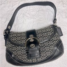 Coach Signature Sufflette Leather Handbag Very Good Condition Black, Leather A Rare Vintage Piece For Coach Enthusiasts! This Is A Coach Vintage Black Signature Iconic Signature Jacquard Fabric & Leather Soho Hobo Buckle Purse With No Call Outs And In Aaa+ Condition. Coach Shoulder Bag With Silver-tone Hardware, Chic Black Hobo Bag With Silver-tone Hardware, Top Handle Hobo Bag With Branded Hardware, Hobo Bag With Branded Hardware And Top Handle, Chic Coach Satchel With Silver-tone Hardware, Elegant Coach Hobo Bag With Branded Hardware, Chic Coach Hobo Bag With Detachable Handle, Elegant Coach Hobo Bag With Silver-tone Hardware, Coach Vintage Handbags