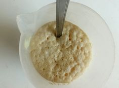 a bowl with some food in it and a fork sticking out of the top one