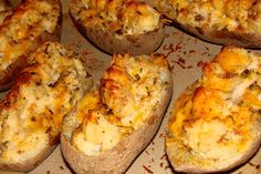 baked stuffed potatoes with cheese and seasoning on top