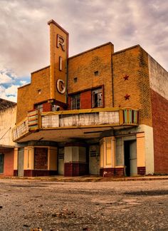 an old building with a large sign on the front