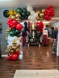 a room filled with lots of balloons and christmas decorations